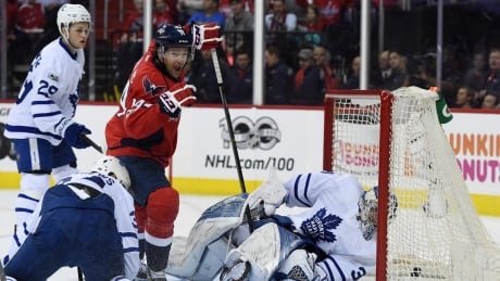 Washington Capitals forward Justin Williams scores against the Toronto Maple Leafs in Washington's 3-2 overtime win Thursday in Washington, D.C. leafs-041317-620