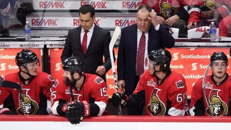 Senators head coach Guy Boucher, left, hopes his team will learn quickly from its Game 1 loss against the Bruins. HKN Bruins Senators 20170412