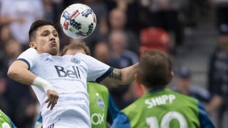 Ex-Seattle striker Fredy Montero, left, scored both goals to lead Vancouver to a 2-1 victory on Friday night. fredy-montero
