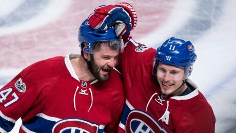 Montreal Canadiens forward Brendan Gallagher, right, congratulates teammate Alexander Radulov after scoring the winning goal against the New York Rangers during overtime in Game 2 on Friday in Montreal. HKN Rangers Canadiens 20170414
