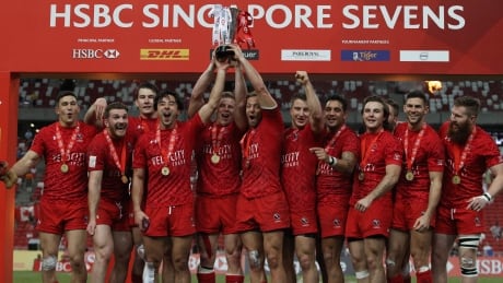 The Canadian men's rugby sevens team celebrates their victory in the final over the U.S. on Sunday at the HSBC Singapore Sevens. HSBC Singapore Sevens