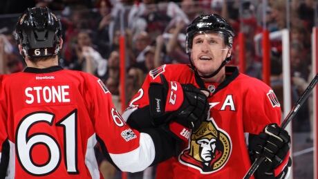 Dion Phaneuf of the Ottawa Senators is pictured with teammate Mark Stone after he scored in overtime against the Boston Bruins in Game 2 in Ottawa on Saturday. senators-041517-620