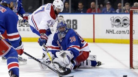 Montreal Canadiens' Alexander Radulov, left, scores a goal past New York Rangers goalie Henrik Lundqvist during the third period. canadiens-rangers