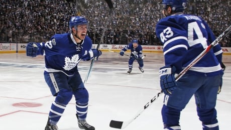 Toronto's Tyler Bozak, left, celebrates his overtime goal with Nazem Kadri on Monday, giving the Leafs a 2-1 series lead over Washington. 95373310
