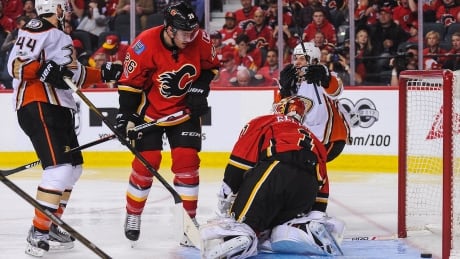 Rickard Rakell (67) after his teammate Corey Perry scored the game-winning goal to defeat the Calgary Flames in overtime of Game 3. Anaheim holds a 3-0 series lead. flames-ducks