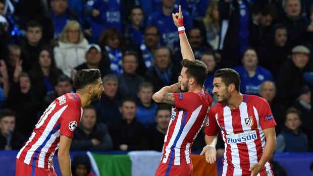 Saul Niguez centre celebrates his goal to give Atletico Madrid a draw against Leicester City