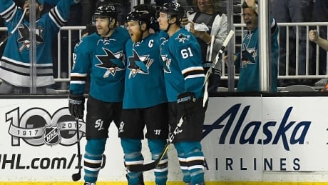 Joe Pavelski, Patrick Marleau and Justin Braun celebrate after Pavelski scored a goal against the Edmonton Oilers during the first period. sharks-oilers