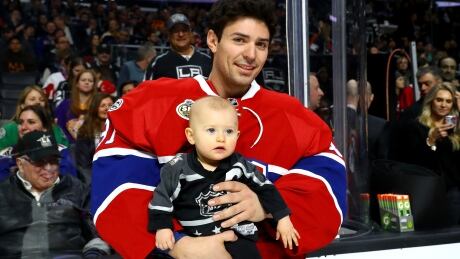 Montreal Canadiens goalie Carey Price, shown in this file photo holding his daughter Liv Anniston, is just one of many NHLers balancing playoff hockey and home life. 694217583TB00066_Honda_NHL_