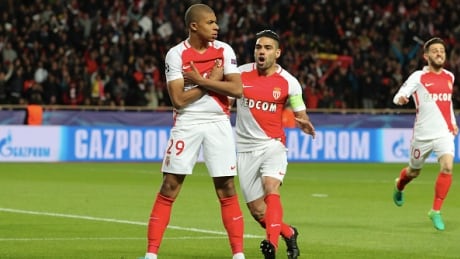 Kylian Mbappe of AS Monaco, left, celebrates his goal with Radamel Falcao during the Champions League quarter-final second leg against Borussia Dortmund . Kylian-Mbappe