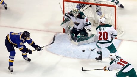 St. Louis Blues' Patrik Berglund shoots wide of Minnesota Wild goalie Devan Dubnyk (40) in the first period. wild-blues