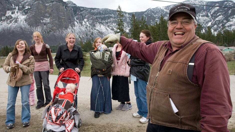Winston Blackmore, the religious leader of the polygamous community of Bountiful located near Creston, B.C., with six of his daughters and some of his grandchildren in 2008.