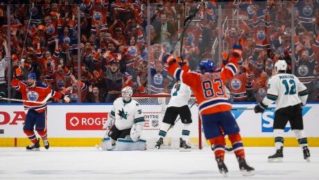 San Jose Sharks goalie Martin Jones looks on as the Edmonton Oilers celebrate their tying goal during the third period in Edmonton on Thursday. The Oilers trailed 3-1 and eventually won in overtime. oilers-sharks-042017-620