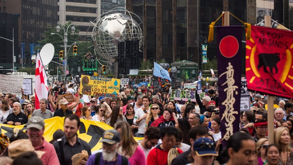 People protest for greater action against climate change during the People's Climate March in New York City.