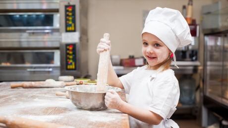 Girl baking with flour 