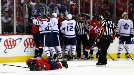 Washington Capitals captain Alex Ovechkin lies on the ice after taking a controversial hit from Toronto Maple Leafs forward Nazem Kadri. Ovechkin-Alex-04212017
