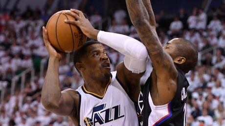 Joe Johnson, left, scored of his points in the fourth quarter to lead the Utah Jazz to a - victory over the Los Angeles Clippers on Sunday evening. joe-johnson