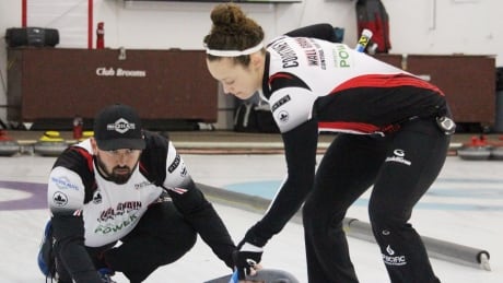 Canada's Reid Carruthers and Joanne Courtney, took an early lead Monday against Kazakhstan with a deuce in the first end en route to a 14-0 victory at the world mixed doubles curling championship in Lethbridge, Alta. Curling-Duo