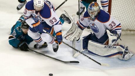 Oilers Ryan Nugent-Hopkins (93) and Cam Talbot (33) say the team's first playoff win against San Jose has given the team confidence it can go further. Oilers Sharks Hockey