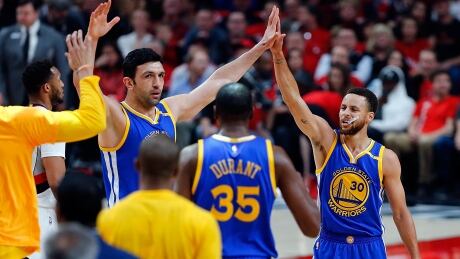 Steph Curry (30) of the Golden State Warriors celebrates a three point shot with Zaza Pachulia (27) against the Portland Trail Blazers during Monday's Game 4 win. warriors