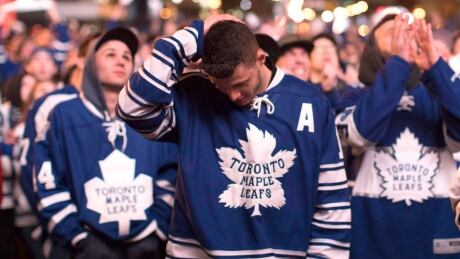 Toronto Maple Leafs fans react as the Washington Capitals score an overtime goal to win game 1 of the Stanley Cup playoffs at Maple Leaf Square, in Toronto on Thursday, April 13, 2017. THE CANADIAN PRESS/Chris Young HKN Maple Leafs Capitals 20170413