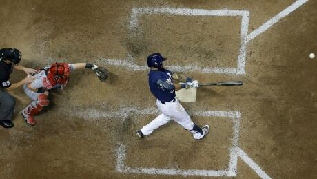 Milwaukee Brewers' Eric Thames hits his league-leading 11th home run of the season Tuesday against the Cincinnati Reds. Reds Brewers Baseball