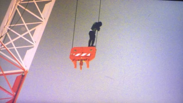 Woman on crane: How and why she got there are mysteries