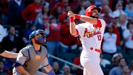 St. Louis Cardinals' Matt Carpenter and Toronto catcher Russell Martin watch Carpenter's game-winning grand slam in Game 1 of a double-header Wednesday. Blue Jays Cardinals Baseball
