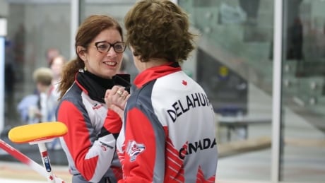 Colleen Jones and Nancy Delahunt celebrate their win over Scotland, which landed landing Team Canada in the gold medal game. Colleen Jones