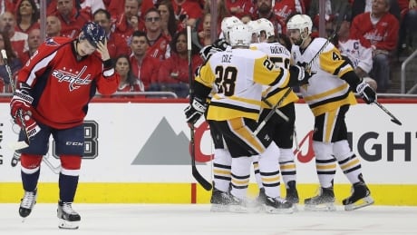 Jake Guentzel (59) of the Pittsburgh Penguins celebrates after scoring a second period goal against the Washington Capitals in Game 2 of their second round matchup. penguins
