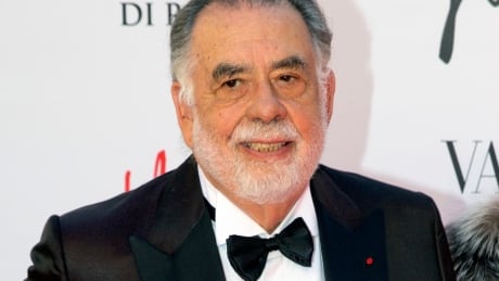 FILE - In this May 22, 2016 file photo, director Francis Ford Coppola poses for photographers as he arrives for the premiere of Verdi's "La Traviata'' at the Rome Opera House, in Rome. Coppola and the cast of "The Godfather" reunited for one evening and a double feature at Radio City Music Hall to celebrate the film's 45th anniversary. The Tribeca Film Festival closed out its 16th edition Saturday, April 29, 2017, with a grand double feature of "The Godfather," parts one and two. Tribeca Godfather Reunion