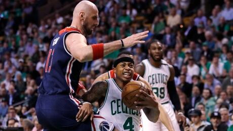 Boston's Isaiah Thomas drives past Washington's Marcin Gortat on his way to a 53-performance in the Celtics' 129-119 win in Game 2 Tuesday. Wizards Celtics Basketball