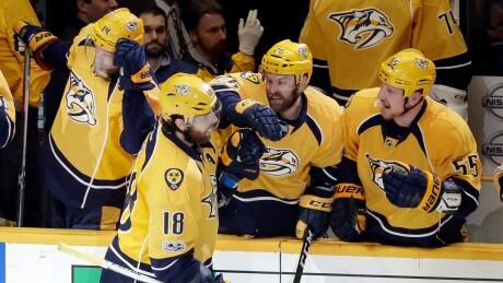 Nashville Predators right wing James Neal (18) is congratulated after scoring a goal against the St. Louis Blues during the third period. blues-predators