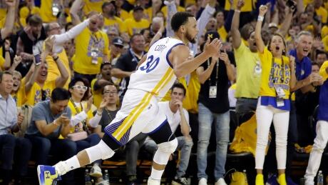 Golden State Warriors' Stephen Curry (30) celebrates after scoring against the Utah Jazz during the first half in Game 1. jazz-warriors
