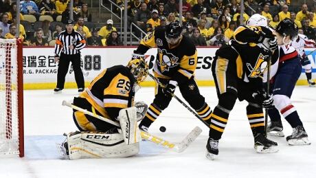 Pittsburgh Penguins goalie Marc Andre-Fleury makes a save against the Washington Capitals in Game 4. fleury