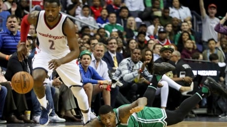 Boston Celtics guard Marcus Smart (36) dives after a ball stollen by Washington Wizards guard John Wall (2) during the first half in Game 3 of a second-round NBA playoff series basketball game, Thursday, May 4, 2017, in Washington. (AP Photo/Andrew Harnik) Celtics Wizards Basketball