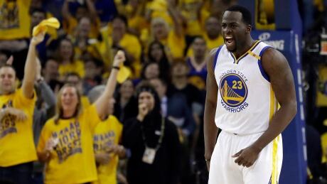 Golden State Warriors' Draymond Green celebrates after scoring against the Utah Jazz during the first half of Game 2 on Thursday in Oakland, Calif. green-draymond-050417-620