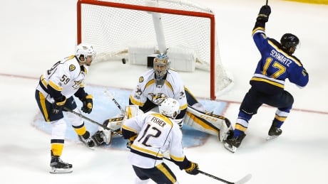 St. Louis Blues left wing Jaden Schwartz (17) celebrates after scoring a goal against Nashville Predators goalie Pekka Rinne (35), leading the Blues to a 2-1 win in Game 5 of the second round. Predators Blues Hockey