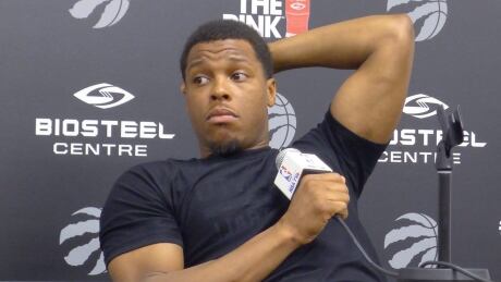 Toronto Raptors guard Kyle Lowry, seen speaking at a news conference last month, says he is doubtful to play in Game 4 against the Cleveland Cavaliers on Sunday in Toronto. The Raptors are facing elimination. lowry-kyle-042617-620