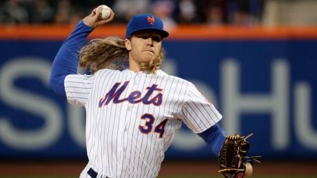 New York Mets pitcher Noah Syndergaard, seen above throwing earlier this season, is dealing with a partially torn muscle behind his arm and is unlikely to return to the lineup before the All-Star break. syndergaard-noah-042717-620