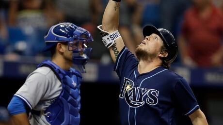 Tampa Bay Rays' Colby Rasmus, right, celebrates in front of Toronto Blue Jays catcher Luke Maile after hitting a two-run home run off Marco Estrada on Saturday. Blue Jays Rays Baseball