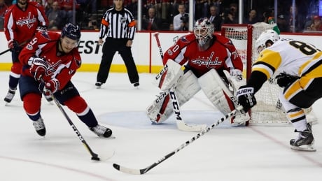 Washington Capitals defenceman Dmitry Orlov (9) clears the puck in Saturday's 4-2 win over the Pittsburgh Penguins in Game 5. Penguins Capitals Hockey