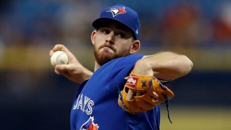 Toronto Blue Jays pitcher Joe Biagini throws to the Tampa Bay Rays during the first inning of his first career big league start on Sunday in St. Petersburg, Fla. biagini-joe-050717-620