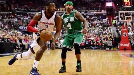 John Wall, left, had 27 points and 12 assists to lead the Washington Wizards to a 121-102 victory over the Boston Celtics on Sunday evening. john-wall