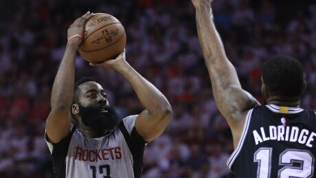 James Harden, left, had 28 points, including four three-pointers, as the Houston Rockets tied their series with the San Antonio Spurs on Sunday evening. james-harden