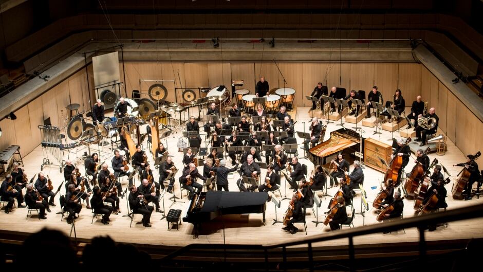 A Toronto Symphony Orchestra performance, which includes the use of a new instrument made out of a giant steel sheet.