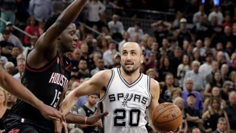 San Antonio Spurs' Manu Ginobili (20) drives to the basket past Houston Rockets' Clint Capela (15) for a shot during the second half in Game 5. rockets-spurs