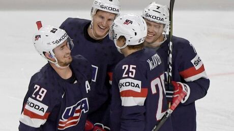 Islanders forward Brock Nelson, left, celebrates one of two goals he scored in a 3-0 victory by the United States over Italy at the world hockey championship on Wednesday. nelson-brock-051017