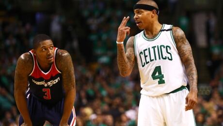 Boston's Isaiah Thomas lets Washington's Bradley Beal know he's looking to score two points in the Celtics' Game 5 win Wednesday. 95733059