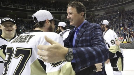 Pittsburgh Penguins center Sidney Crosby (87) hugs owner Mario Lemieux after Game 6 of the NHL hockey Stanley Cup Finals between the San Jose Sharks and the Penguins in San Jose, Calif., Sunday, June 12, 2016. The Penguins won 3-1 to win the series 4-2. (Bruce Bennett/Getty Images via AP, Pool) crosby-lemieux-160612-1180