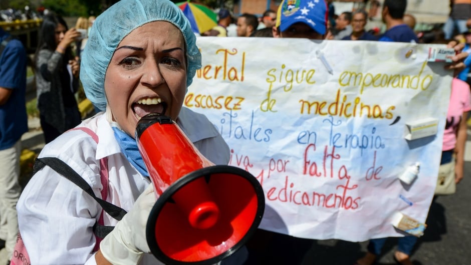 Health-care workers protest against Venezuela's president Nicolas Maduro's government about the lack of medicines and low salaries in the country, Feb. 7, 2017.